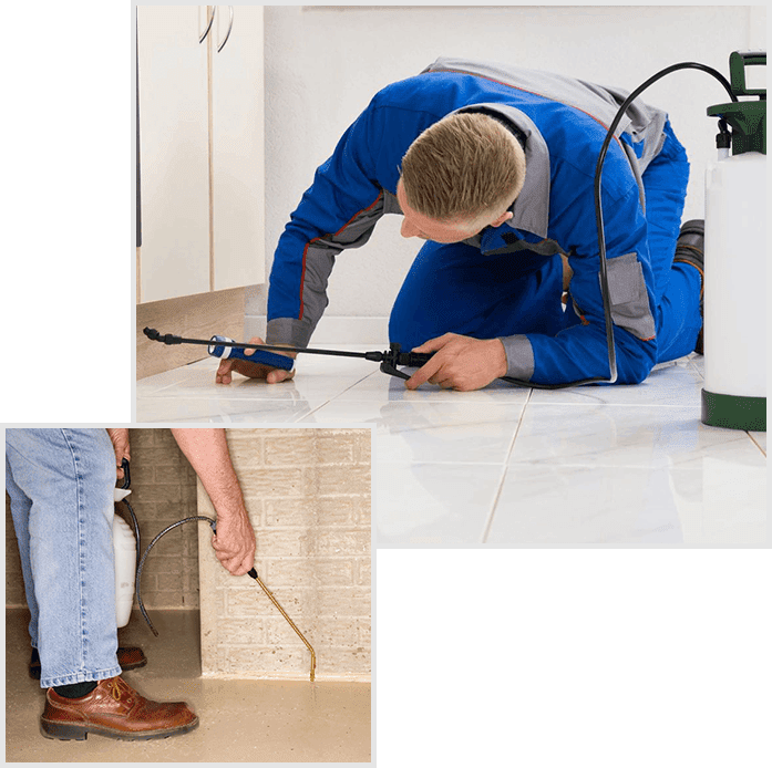 A man in blue work clothes working on the floor of a bathroom.